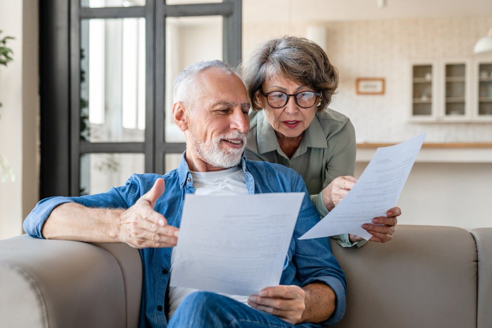 old-couple-looking-at-mortgage-note
